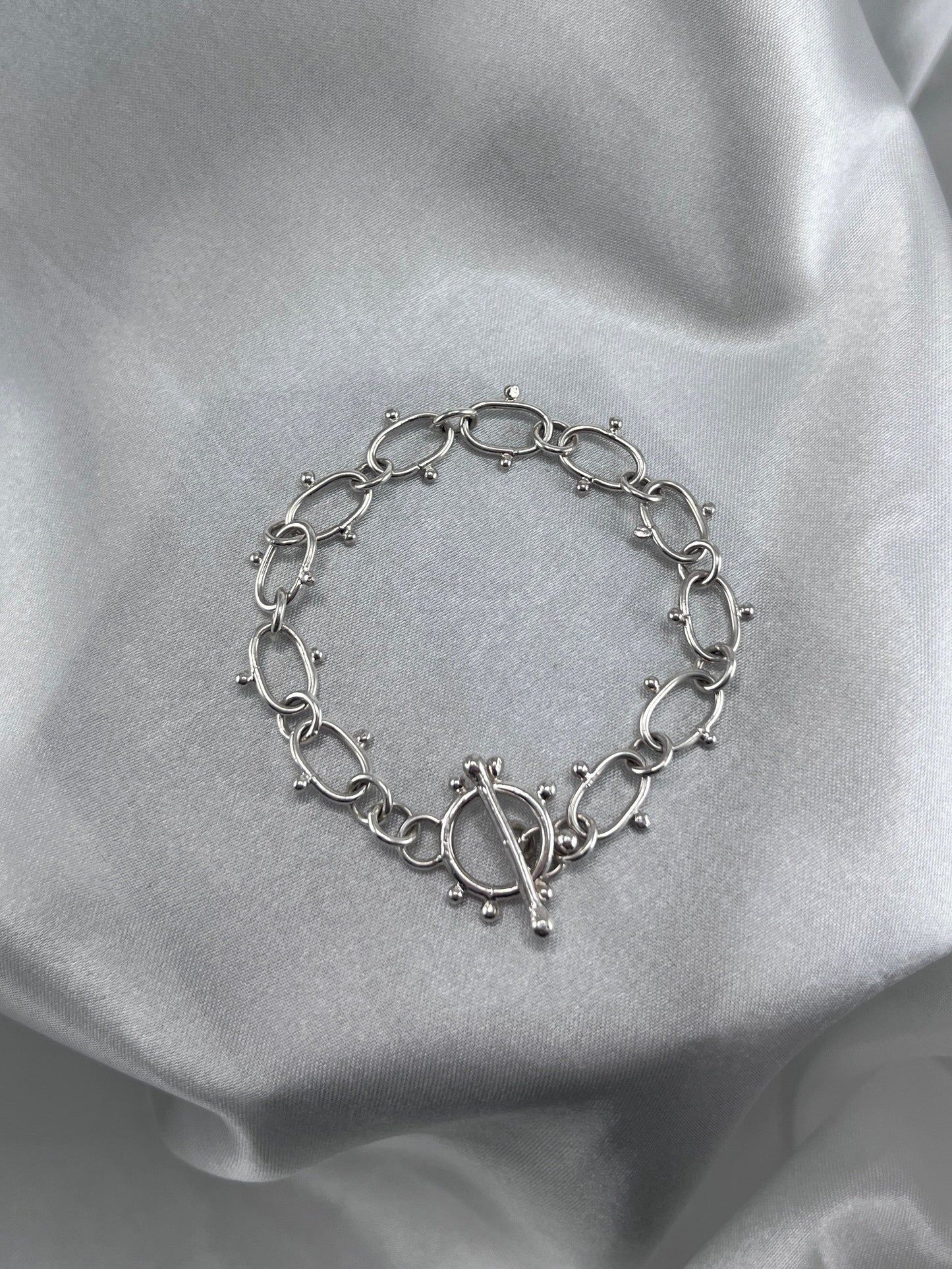 Silver chain bracelet with dot details