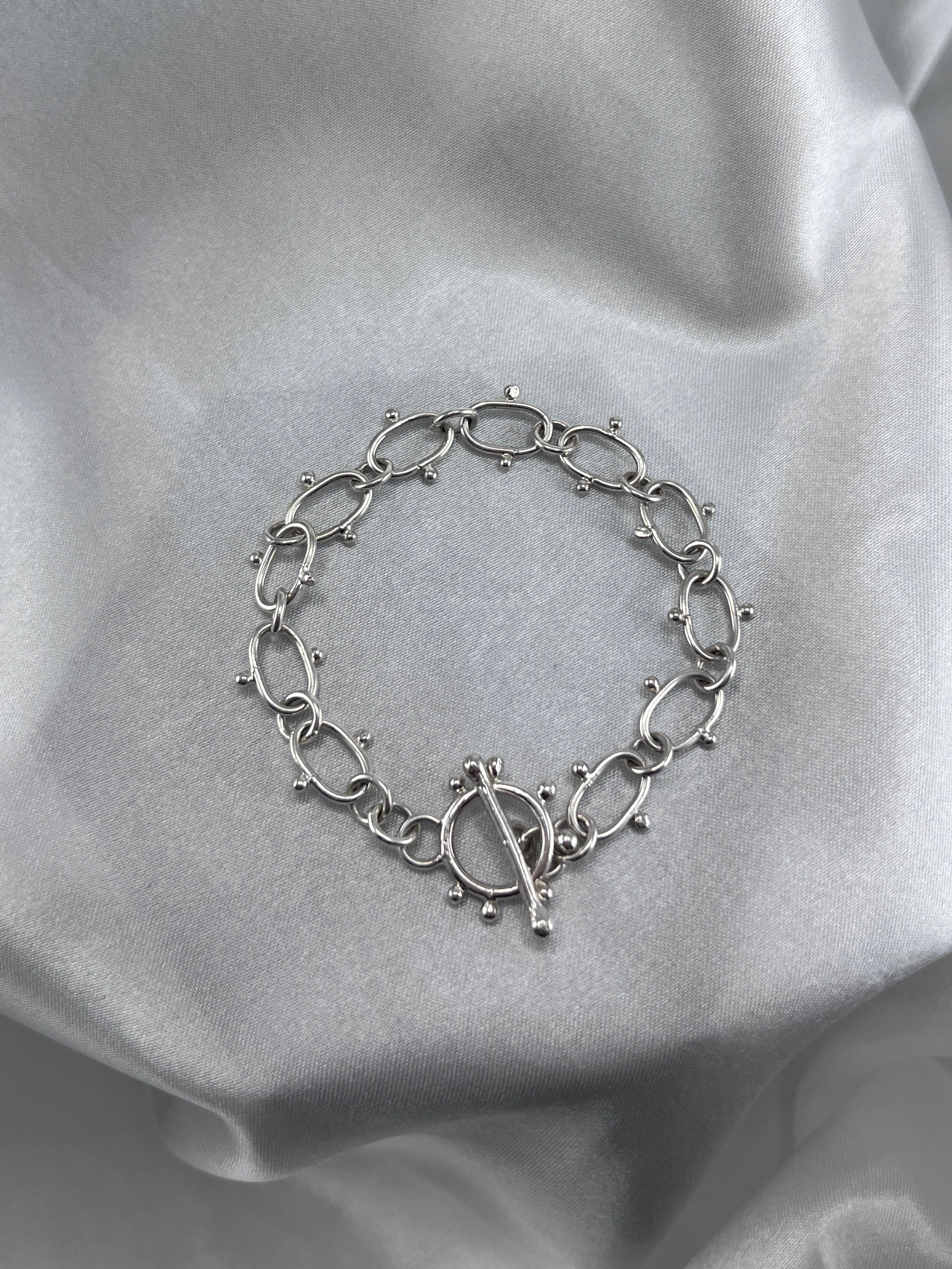 Silver chain bracelet with dot details