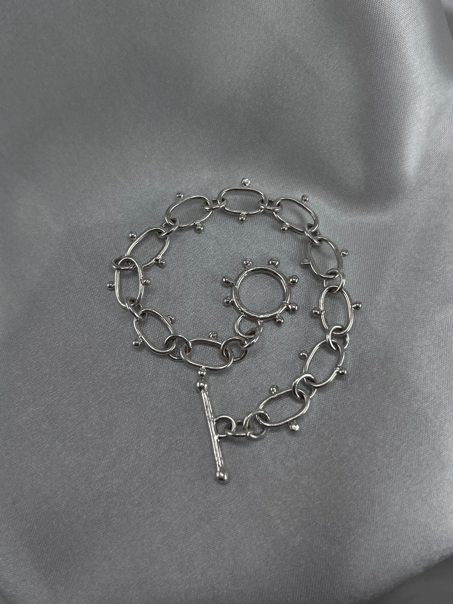 Silver chain bracelet with dot details